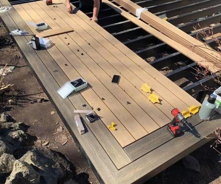 Installing new composite deck boards with a dark picture-frame border